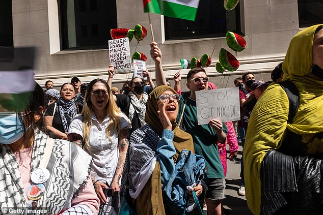 Pro-Palestinian protesters confront a small group of Israeli protesters during mourning events outside the New York Stock Exchange.