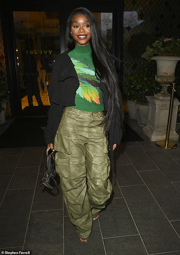 Tanya paired the number with a striking green jumper and a cropped black jacket.