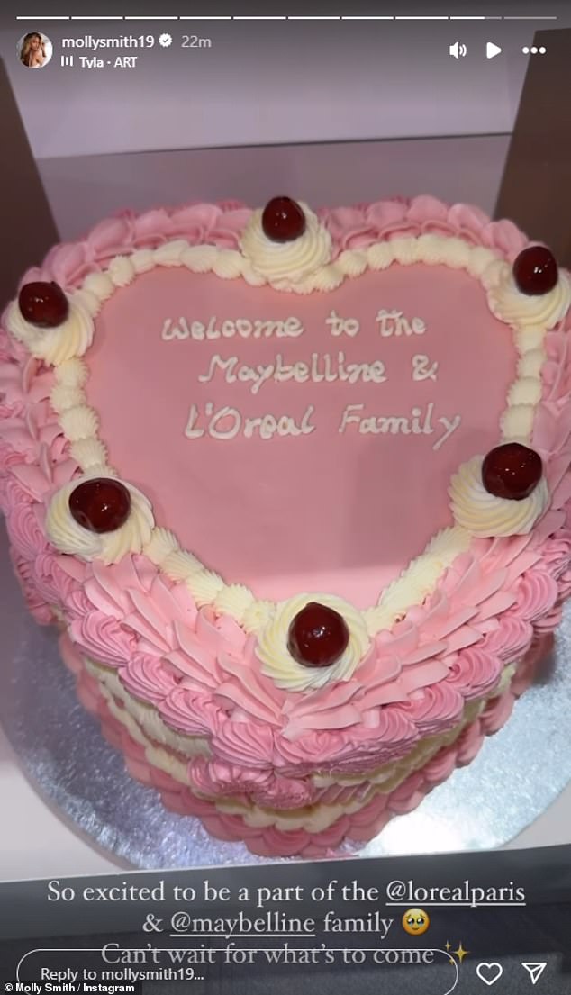 Molly also shared a photo of a luxurious pink heart-shaped cake that had writing 