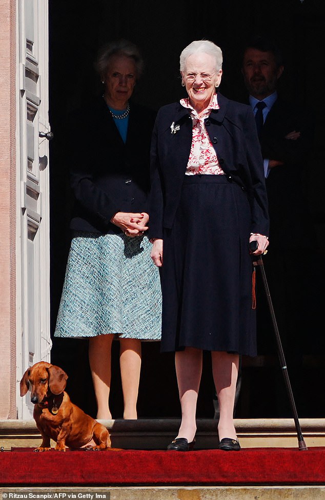 Queen Margaret smiles alongside her beloved pup as she greets royal fans outside Fredensborg Castle ahead of her 84th birthday festivities.