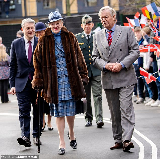 Queen Margaret appears smiling as crowds gather to watch her journey to inaugurate the new Prins Henriks Skole.