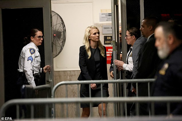 Harp, 32, is among the aides on Trump's side during the process. He is seen returning to the courtroom Monday after a break in Trump's criminal trial related to hush money payments to porn star Stormy Daniels.