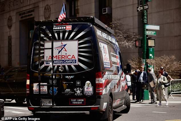 A Trump supporter drives a van past Manhattan Criminal Court on Tuesday