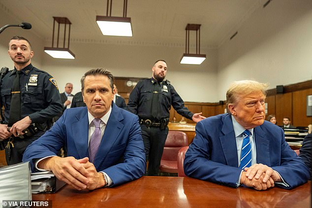 Former US President Donald Trump sits in the courtroom with attorney Todd Blanche on the second day of his trial in Manhattan Criminal Court, New York, New York, USA, April 16, 2024.