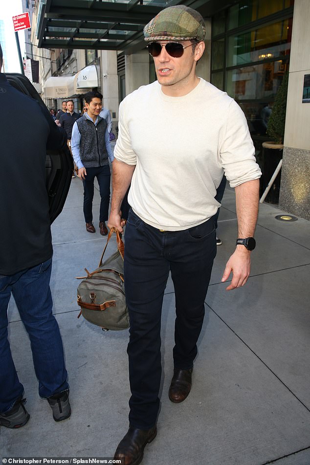 Cavill was seen leaving the luxury hotel on 56th Street in Midtown Manhattan on Tuesday wearing a white sweatshirt with rolled-up sleeves.