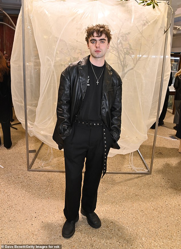 Liam Gallagher's son Lennon, 24, cut a modern figure in an all-black ensemble and opted for a leather jacket.