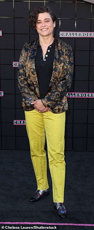 Katy O'Brian, 35, showed off her unique sense of style in bright lime pants, a black top, and a gold and black metallic jacket.