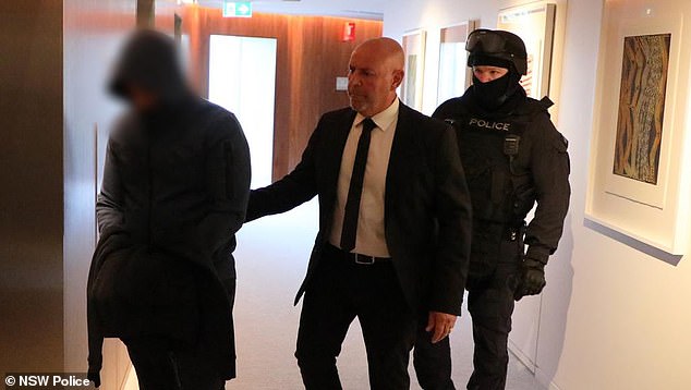 Mohamad Alameddine (left) is pictured after being arrested at his penthouse in Sydney.