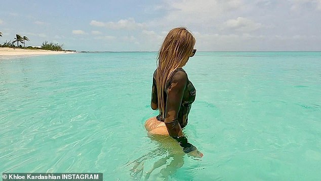 She shared a snap showing off her famous derriere in a sexy swimsuit during her recent family vacation to the Turks and Caicos Islands. In her caption, she mocked Kim crying over losing her earrings in the ocean in an iconic Keeping Up with the Kardashians moment in 2011. She cited her older sister Kourtney Kardashian's response to Kim's theatrics, as documented in his previous reality show. show and wrote: 'KIM, THERE ARE PEOPLE WHO ARE DYING'