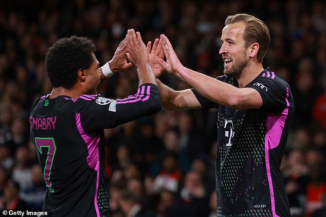 Harry Kane (right) scored as the Bundesliga giants earned a 2-2 draw at the Emirates.