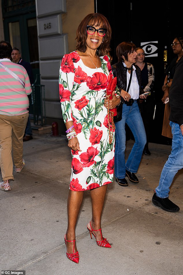 Gayle King, 69, was also spotted before the show in a mood-enhancing bright red look.  The television personality modeled a short-sleeved white midi dress covered in red poppies and green leaves.  She paired the daring dress with a T-strap, red sandals, and a matching leather bag and ombré-style glasses.