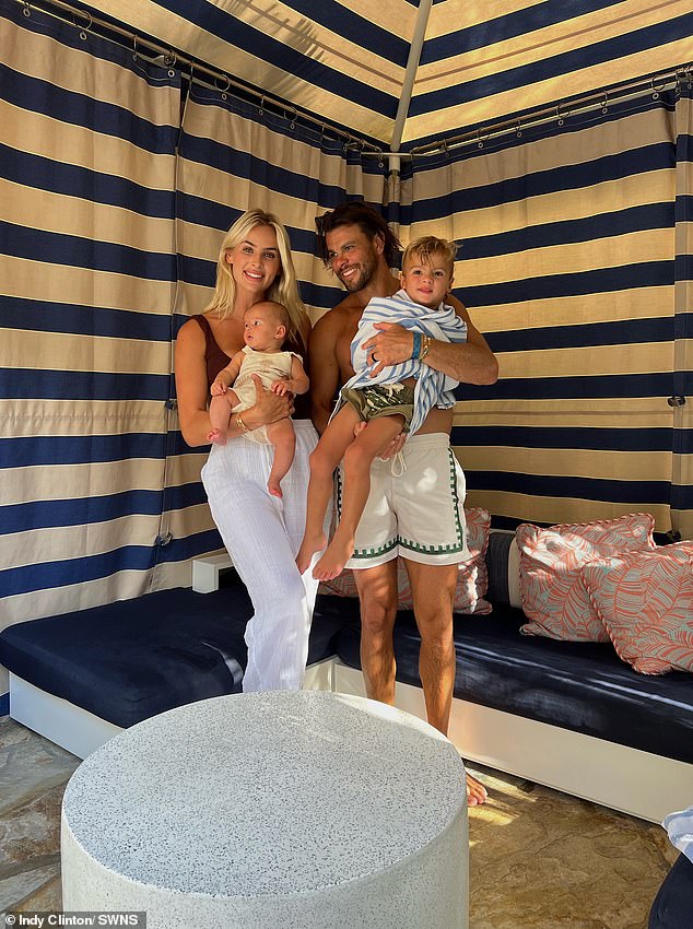 The influencer's mom vlogs often feature her mischievous toddlers Navy, three, and Bambi, one. Pictured is her with her partner Ben and her two young children, her daughter Bambi and her son Navy.