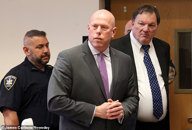 Suspected Gilgo Beach serial killer Rex A. Heuermann, right, appears in Judge Tim Mazzei's courtroom alongside his attorney Michael Brown at the Suffolk County Courthouse in Riverhead on Wednesday.