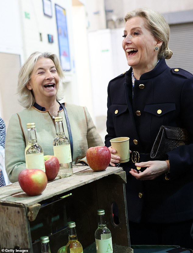 The mother-of-two smiled as she chatted to others at the event and was pictured trying out local produce.