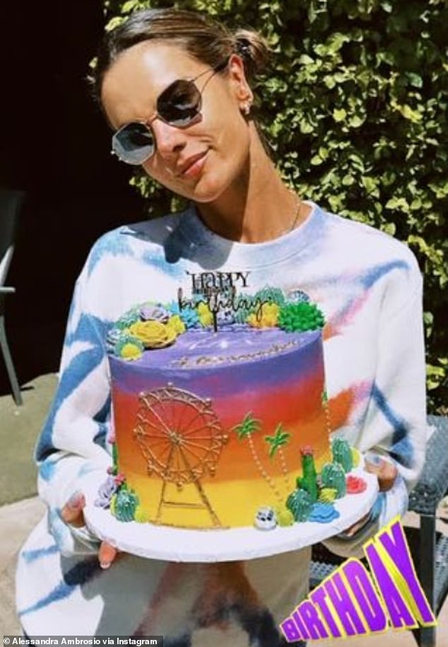 Alessandra arrived at her Coachella home last Thursday and posed with a multicolored birthday cake