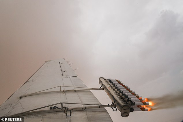 Since the early 1990s, the United Arab Emirates has been using this controversial technique to increase rainfall by 15 to 25 percent. Shown here is a United Arab Emirates plane releasing salt flares into a cloud.