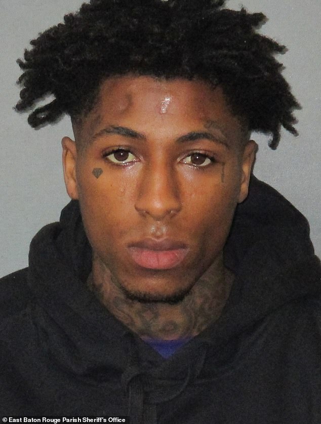 NBA YoungBoy, 24, was indicted on federal gun charges in 2021, but his trial was delayed in March due to an upcoming U.S. Supreme Court decision on relevant gun laws;  photographed in 2020