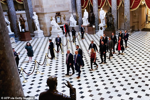 House impeachment managers walk through the Capitol on Tuesday to deliver the articles of impeachment against Mayorkas to the Senate.