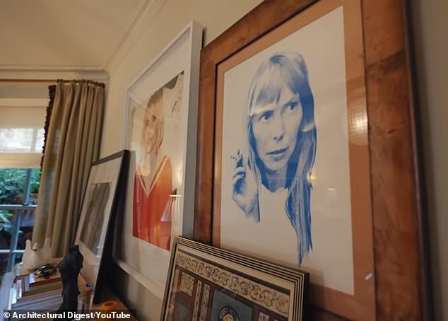 Emma then showed viewers her TV room, which featured an art display of two photographs and an illustration by 80-year-old singer-songwriter Joni Mitchell.