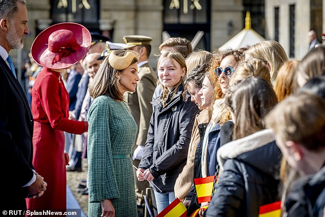 The Kings greeted the public that gathered in Dam Square clutching Spanish flags