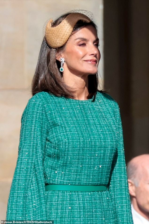 Letizia added a pair of stunning diamond and emerald earrings to complement her elegant outfit.