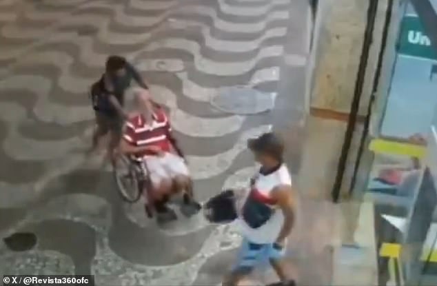 He could be seen shaking his head and waving his arm as a 42-year-old man struggled to push the elderly man toward the door.