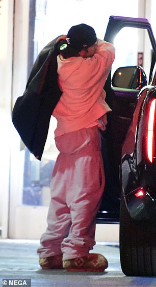 Justin was seen taking off his leather jacket before getting into a waiting car.