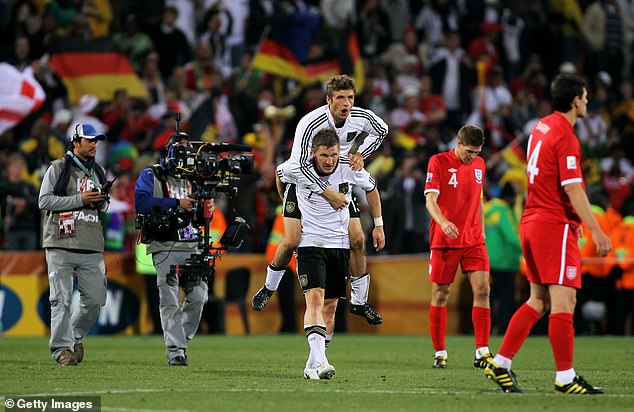Schweinsteiger celebrates after beating Gerrard (right) and Lampard's England in 2010