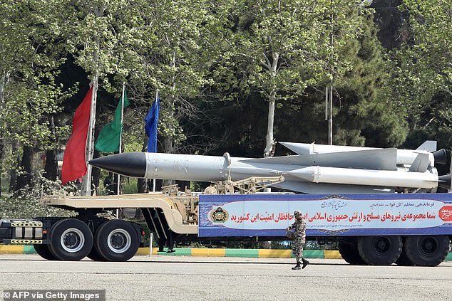 An Iranian military truck carries missiles during a military parade as part of a ceremony marking the country's annual army day in the capital Tehran on April 17, 2024.