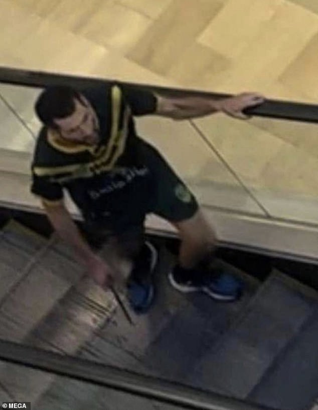 Joel Cauchi from Queensland is pictured carrying a 30cm hunting knife on the escalator inside the Westfield shopping center in Bondi Junction on Saturday afternoon.