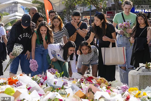 Retail workers from Calvin Klein and Tommy Hilfiger laid flowers at the Bondi Junction memorial site on Monday.