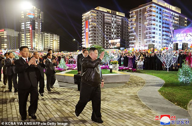 The dictator waved to adoring crowds as he arrived at the event in Pyongyang to mark the completion of the second phase of a 10,000-unit housing development.