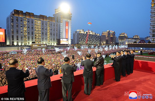 A view from the podium shows the large crowd that gathered at Tuesday's ceremony, with Kim Jong Un greeting the people below.