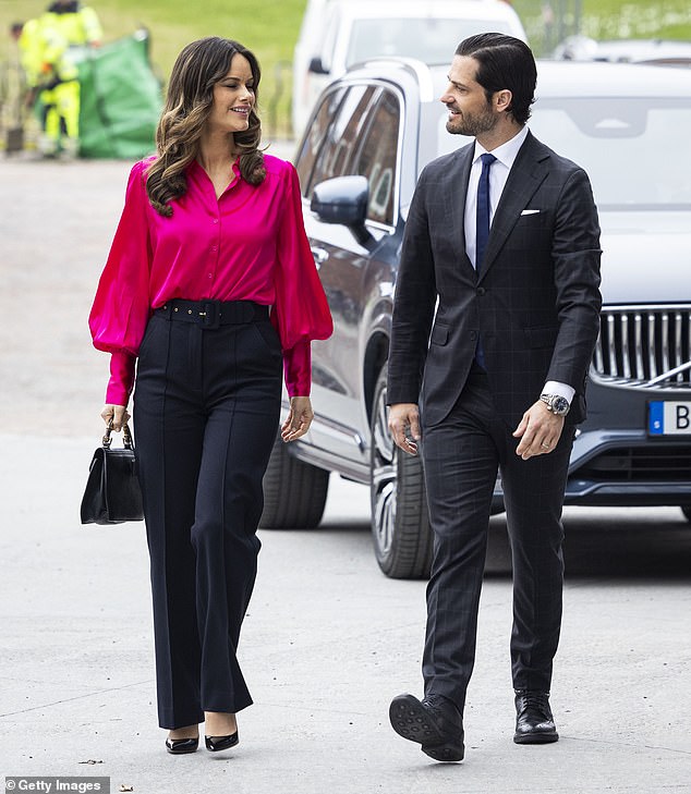 Sofia and Carl Philip shared a sweet smile as they headed to the conference.