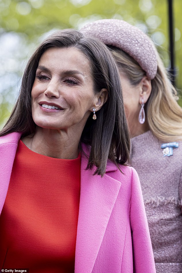 Letizia matched her makeup look to her outfit, sporting bright pink eyeshadow and blush.