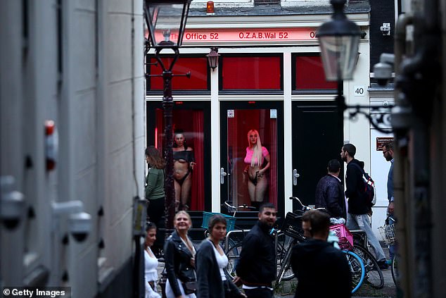 Prostitutes behind the windows in the Red Light District on July 1, 2020 in Amsterdam