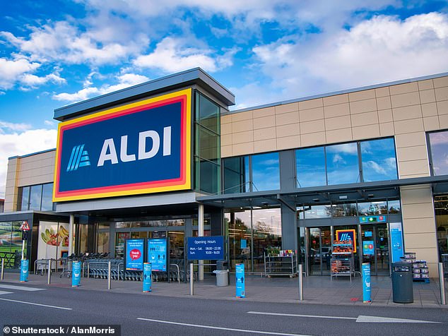 The facade and brand logo of a branch of German discount retailer Aldi, taken in a local shopping park in Wirral, UK, on ​​a sunny afternoon