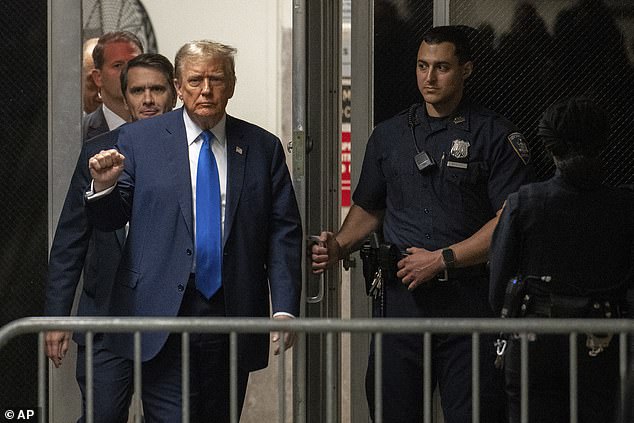 Trump raising his fist upon returning from a break at Manhattan Criminal Court on April 18