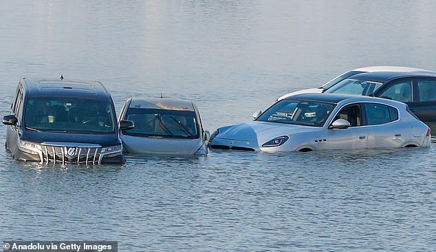 The vehicles were abandoned after the flash floods and remain drowned in the water.