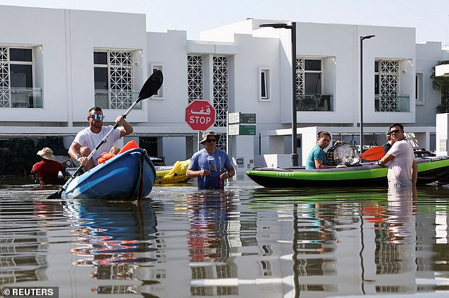 Recent images show locals rowing as a means of navigating through the underwater city.
