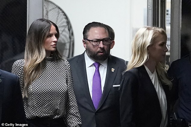 Trump advisers Margo Martin (left), Jason Miller (center) and Natalie Harp (right) return to the Manhattan courthouse after lunch on the third day of jury selection in Trump's hush money case .
