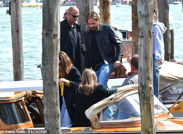 The couples were seen spending time together in the picturesque town and, at one point, boarded a water taxi to head to their next destination.