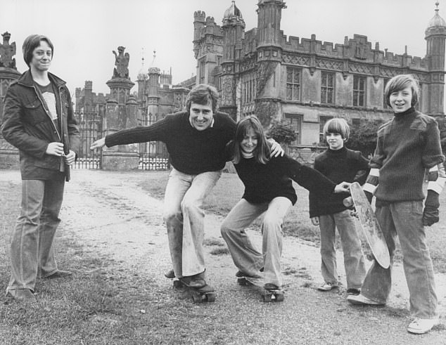 David Lytton-Cobbold and his wife Chryssie on skateboards with their children, Peter, Richard and Rosina, at Knebworth House in Hertfordshire