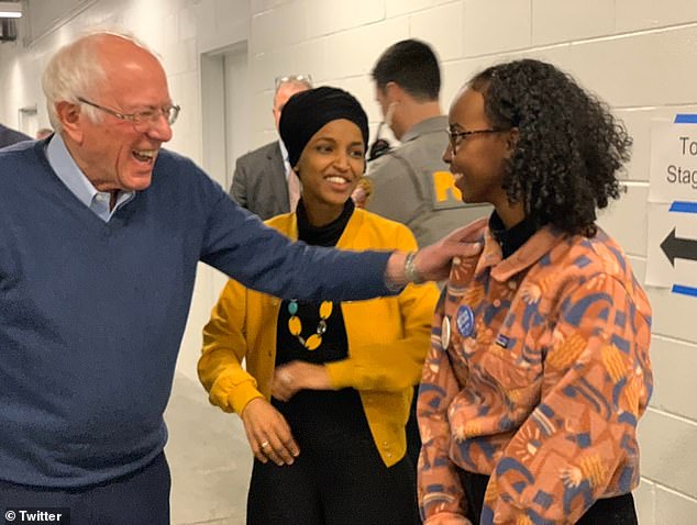 Self-proclaimed Democratic socialist Sen. Bernie Sanders, I-Vt., hugs Hirsi as her mother, Rep. Ilhan Omar, looks on