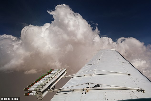 Hygroscopic flares are placed on an aircraft during a cloud seeding flight operated by the National Center of Meteorology, between Al Ain and Al Hayer, in the United Arab Emirates, on August 24, 2022.