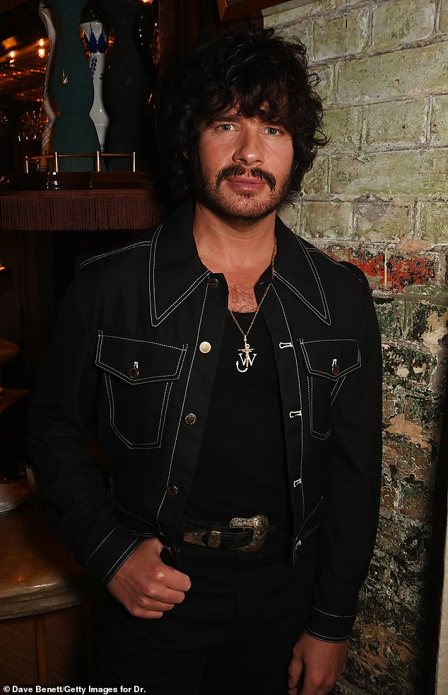 Luke Day looked stunning in a black denim jacket with white stitching and a thick buckled belt.