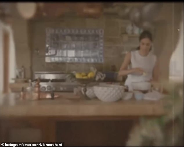 Meghan announced her new business, American Riviera Orchard, with a clip showing the duchess cooking in a kitchen with copper pots hanging above her head as she whisked.