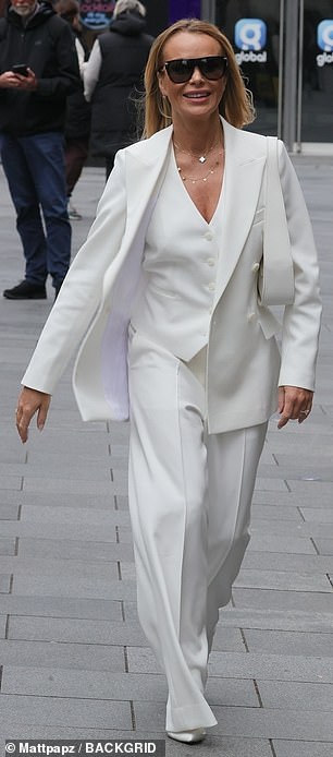 Amanda Holden, 53, looked effortlessly chic in an all-white power suit.
