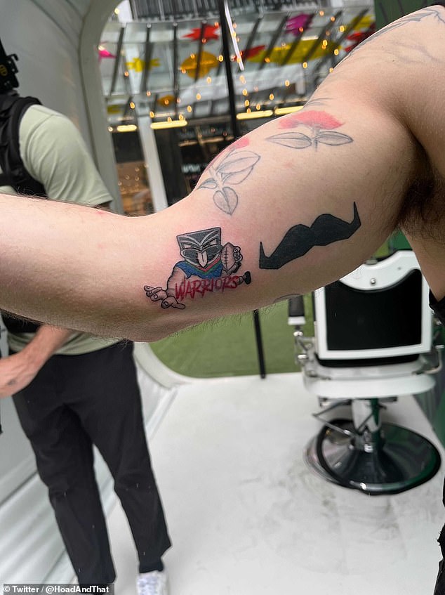 Those brave enough had no say in the ink selection: they simply stuck their arm through the hole and let the artist get to work (pictured, one of the finished designs).