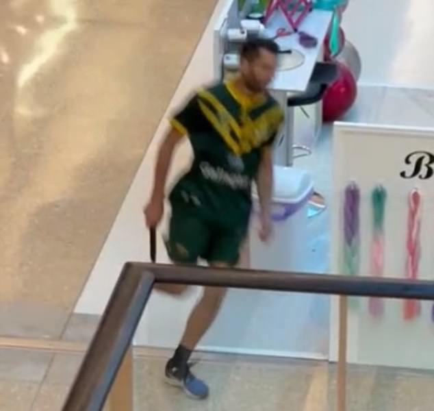 Joel Cauchi is pictured carrying the knife he used to murder six people in Bondi Junction.